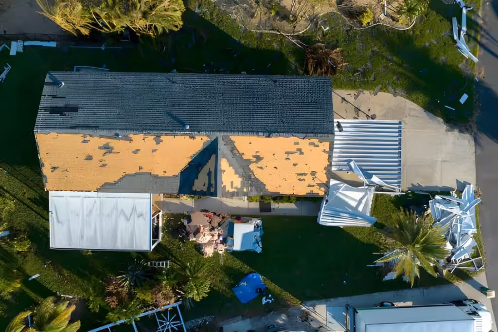 Missing shingles as signs you need a roof replacement Jupiter.