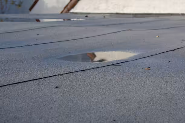 Flat roof drainage problems Jupiter FL climate.